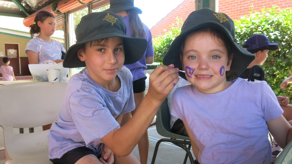 Students pop on purple to fight poverty post image